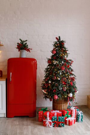 Christmas decorated kithen in loft style. Red colors. Modern loft style of interior dacorated for New Year Eveの写真素材