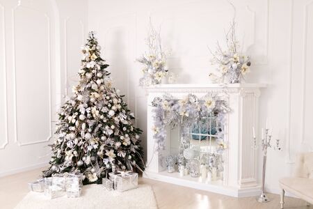 Beautiful Christmas Decorations On The White Fireplaceの写真素材