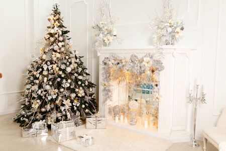 Beautiful Christmas Decoration With White Fireplace In The Roomの写真素材