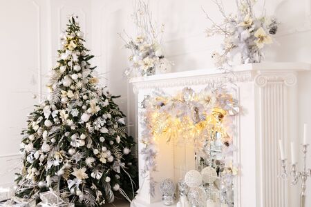 Beautiful Christmas Decoration With White Fireplace In The Roomの写真素材