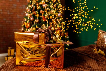 Golden Boxes Of Presents Under The Christmas Treeの写真素材