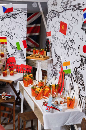 Glasses of cocktail, with mint leaves, orange slice, ice cubes and black straw.の写真素材
