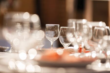 Glasses for wine and champagne on a served table at a banquetの写真素材