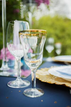 Wine glasses and champagne flutes on table, Wedding decor. Selective focusの写真素材
