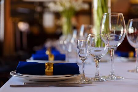 Wine glasses and champagne flutes on table, Wedding decor. Selective focusの写真素材