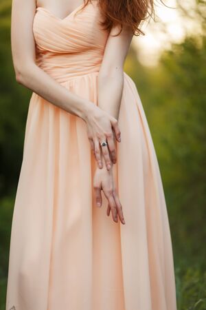 Bride's hands with white gold engagement ringの写真素材