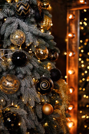 Christmas Balls And Decorations On A Beautiful Christmas Tree. Decorated Christmas Interior.の写真素材