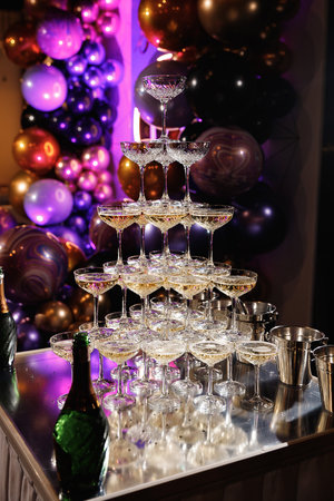 Champagne pyramid for parties at Birthday, party in restaurant. Glasses with champagne in the form of a slide. 2021の写真素材