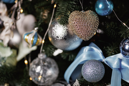 Christmas tree with blue, white and silver balls on it.の写真素材