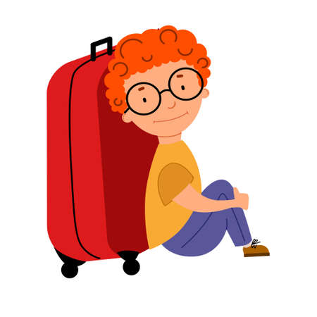 A cute red-haired curly-haired boy with glasses is sitting next to a suitcase.のイラスト素材