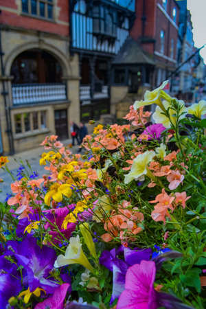 Chester, UK, 22.06.2021: the main shopping street of the city with view to historic buildings. At the moment these are shops, cafes and pubs.のeditorial素材