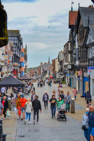 Chester, UK, 22.06.2021: the main shopping street of the city with view to historic buildings. At...