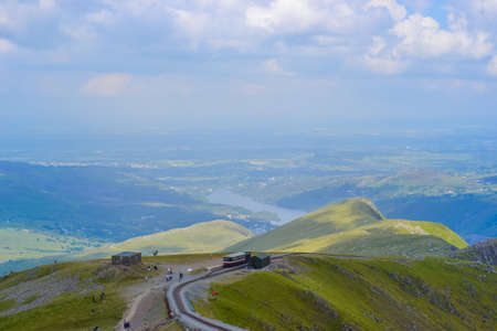 UK, Wales, 12.06.2021:Views of Snowdonia National Park and the old iron dog with the old train going up the mountainsのeditorial素材