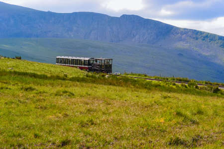 UK, Wales, 12.06.2021:Views of Snowdonia National Park and the old iron dog with the old train going up the mountainsのeditorial素材