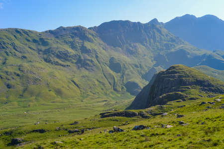 Snowdonia National Park. Epic views of mountains and valleys covered with vibrant grass and soft mossの写真素材