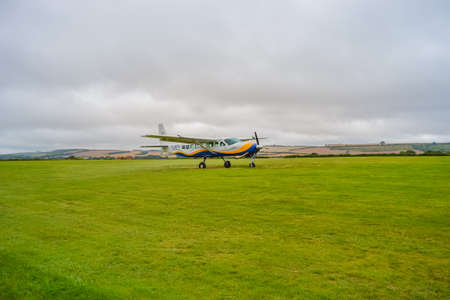 UK, Salisbury, 15.08.2021: a small plane from 'GoSkydive' awaits people to land for parachute jumpingのeditorial素材
