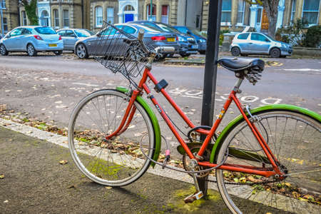 Hove,UK, 08/12/2019: Bright bike on the street. Early winter.のeditorial素材