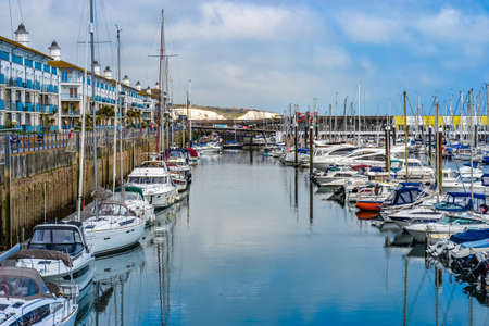 UK, Brighton, 28/06/2020: Brighton Marina centres on the busy yacht harbour, where sailboats moor at the quay.のeditorial素材