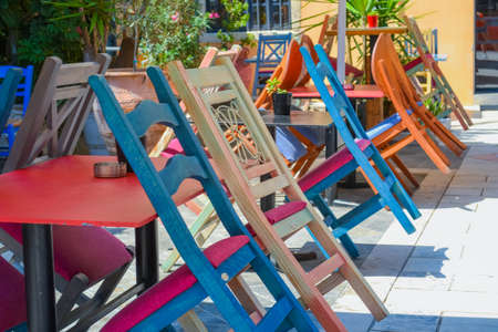 Multicolored chairs in the cafe in Greece Corfu