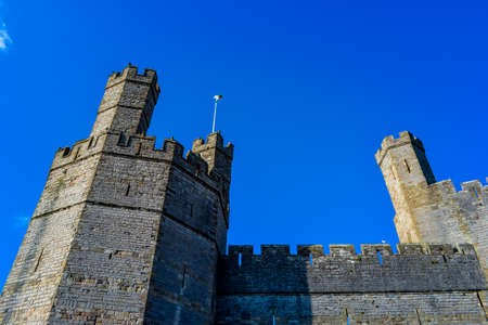 Caernarfon castle towers in bright sunlightのeditorial素材