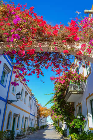 Spain, Gran Canaria, 18.09.2021: Streets of a popular tourist destination (Mogan) in Italian styleのeditorial素材