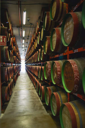 Spain, Gran Canaries, 20.09.2021: Canaries rum factory. Large barrels of rum of different years. Celebrity autographs and local markings on barrels.のeditorial素材