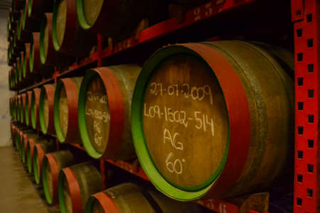 Spain, Gran Canaries, 20.09.2021: Canaries rum factory. Large barrels of rum of different years. Celebrity autographs and local markings on barrels.のeditorial素材