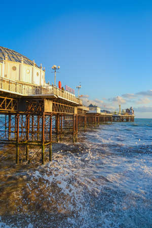 UK, Brighton, 01.10.2021: Photo of waves and splashes in the storm, the famous Brighton pier in the backgroundのeditorial素材