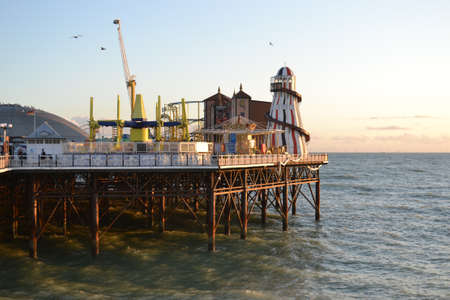 UK, Brighton, 01.10.2021: Brighton's big famous pier. Close up view during sunsetのeditorial素材