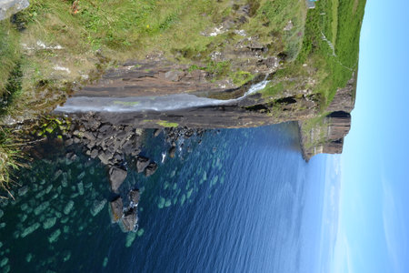 Green mountains and waterfall of scotland in the Highlandsの写真素材