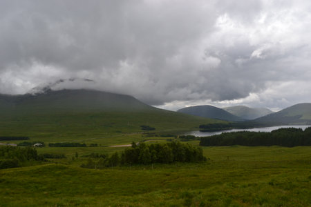 Green mountains and hills of scotland in the Highlandsの写真素材