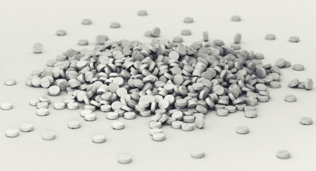 Big heap of pills scattered on the groundの写真素材