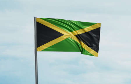Jamaica national flag waving in the wind. Sky background 3D illustrationの写真素材