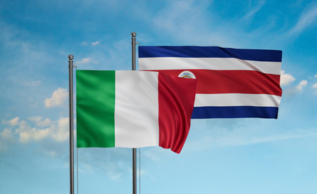 Costa Rico and Italy flag waving together in the wind on blue sky, two country cooperation conceptの写真素材