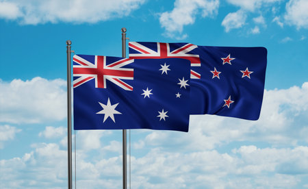New Zealand and Australia flag waving together in the wind on blue sky, two country cooperation...
