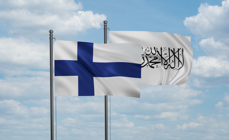 Finland flag and Afghanistan flag waving together in the wind on blue skyの写真素材