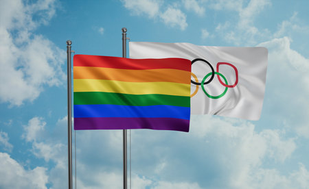 Olympic Games and LGBT movement flag also Gay Pride flag waving together in the wind on blue sky
