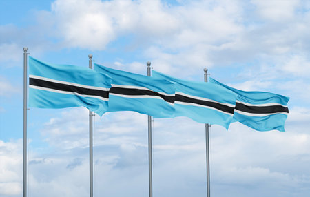 Botswana four flags in row waving together on blue cloudy sky, multiple flags in lineの写真素材