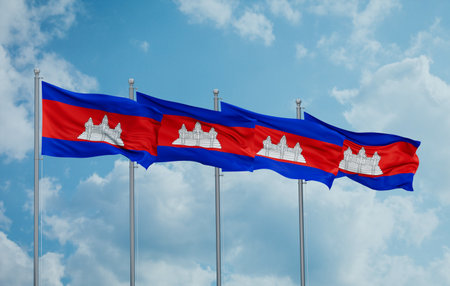 Cambodia four flags in row waving together on blue cloudy skyの写真素材