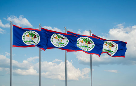 Belize four flags in row waving together on blue cloudy sky