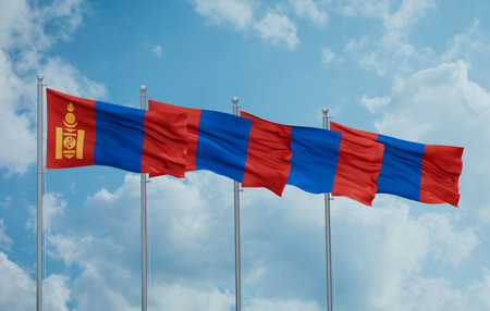 Mongolia four flags in row waving together on blue cloudy sky, multiple flags in lineの写真素材