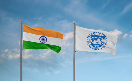 IMF International Monetary Fund and India flags waving together on blue cloudy sky, cooperation conceptのeditorial素材