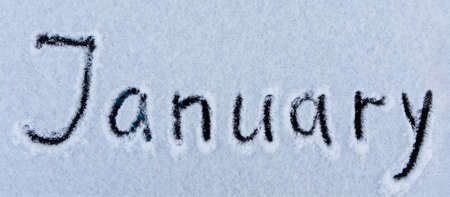 January word written on the surface of a snow field. Winter concept.の写真素材