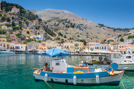 22 JUNE 2017. View of fisherman boats in the bay at Symi island, Greeceのeditorial素材