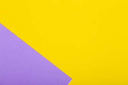 Geometric paper background of yellow and purple colors. Mockup for flat layout compositions