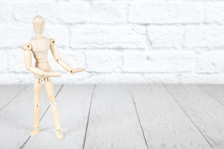 Mockup with wooden human puppet holding  palms upの写真素材