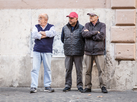 16 October 2015. Rome, Italy: Three senior italian men standing on the street looking seriouslyのeditorial素材