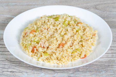 Plate of pearl barley porrige with vegetables. Healthy foodの写真素材