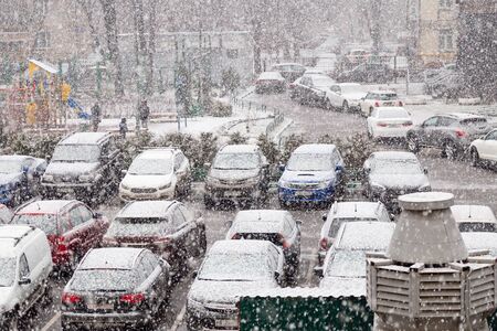 24 MARCH 2019. Moscow, Russia: sudden spring snowfall over a parking lot of residential building.のeditorial素材