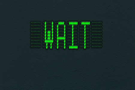 Dark wall texture with LED panel with inscription wait.